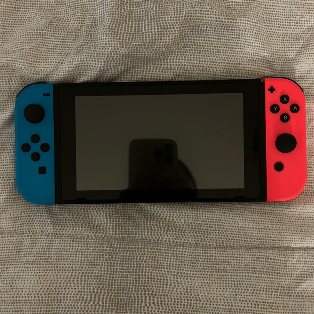 Nintendo switch with 2 games, console, controls, charger